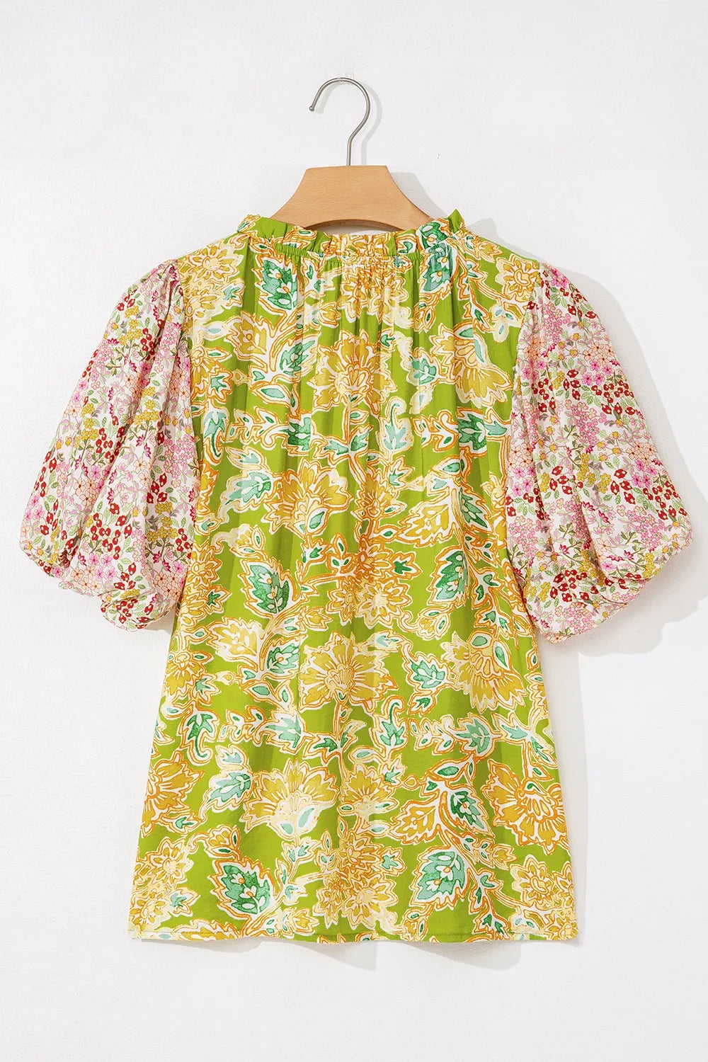 Casual women's patchwork style blouse with contrast bubble sleeves.