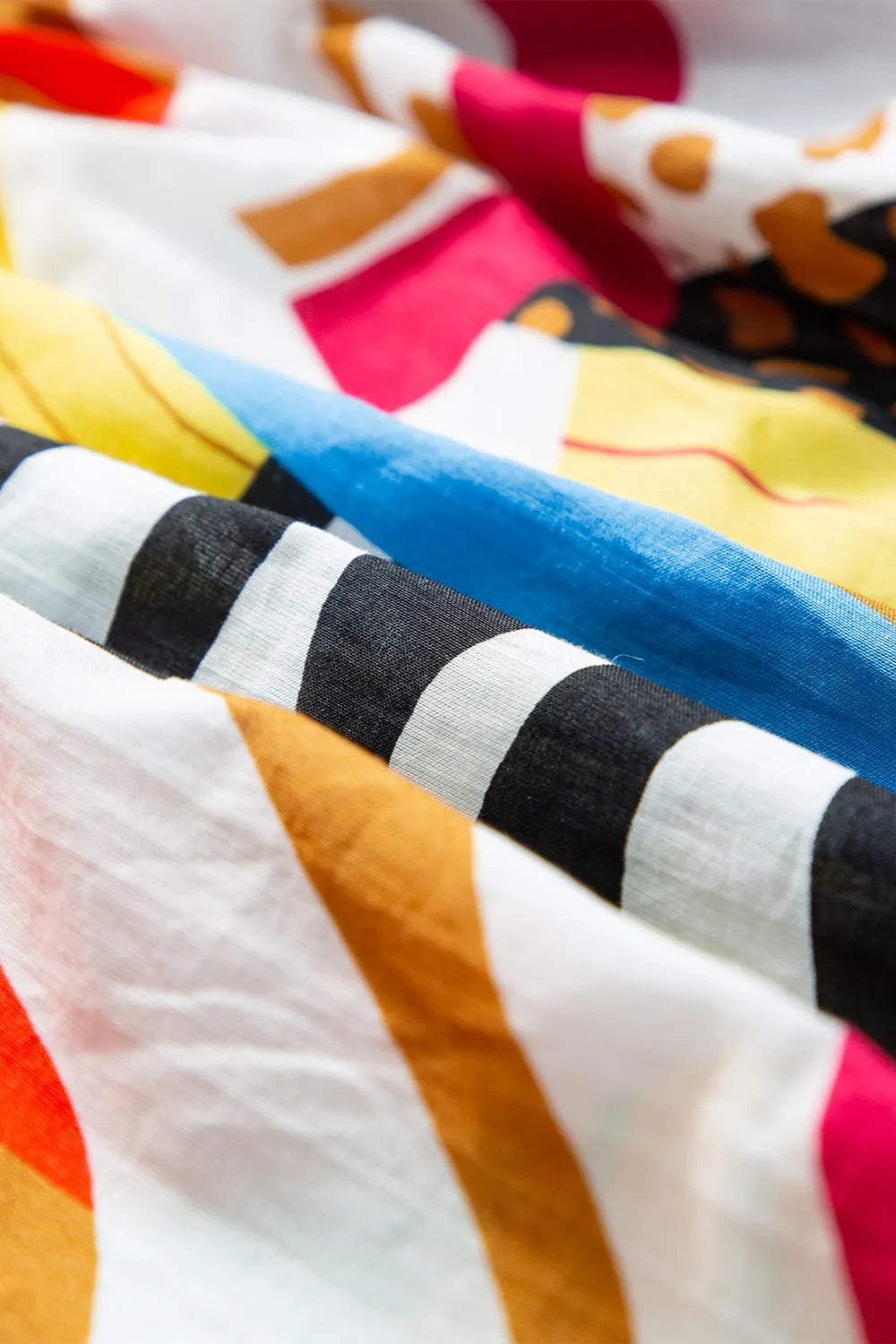 Detail of square neckline on printed short sleeve midi dress.