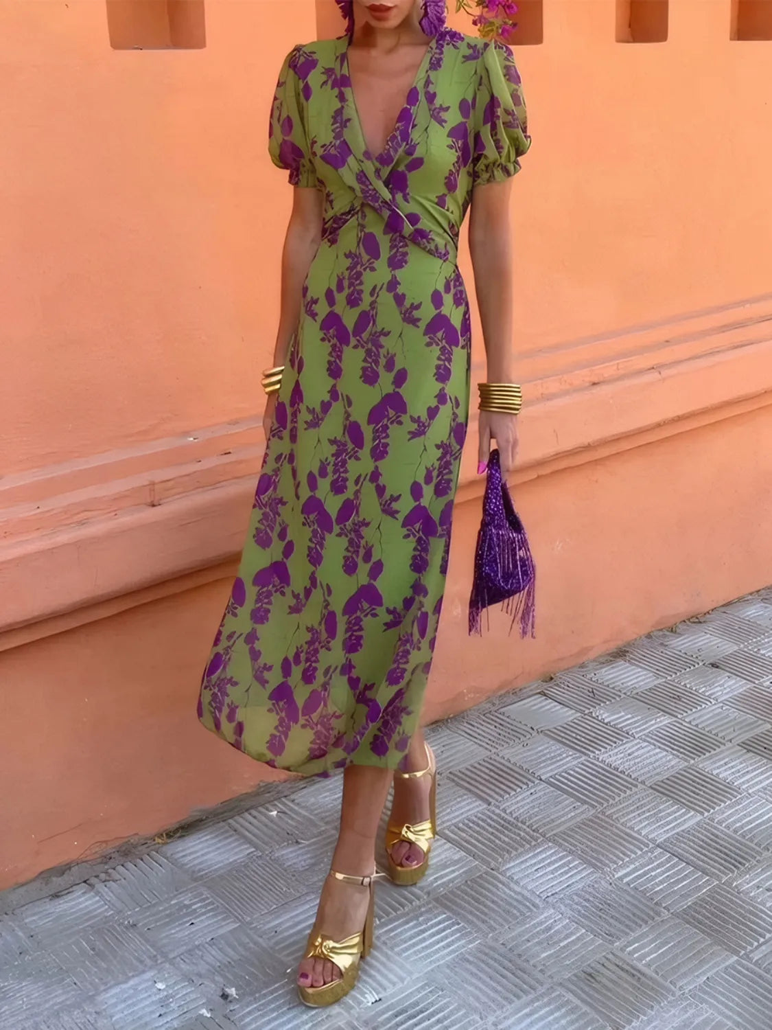 Elegant women's printed midi dress with plunge neck and short sleeves.