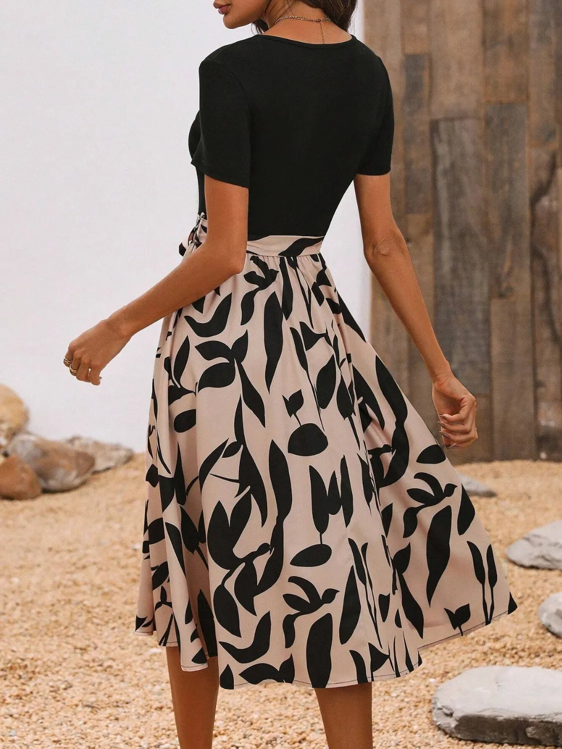 Front view of women's printed round neck short sleeve midi dress.