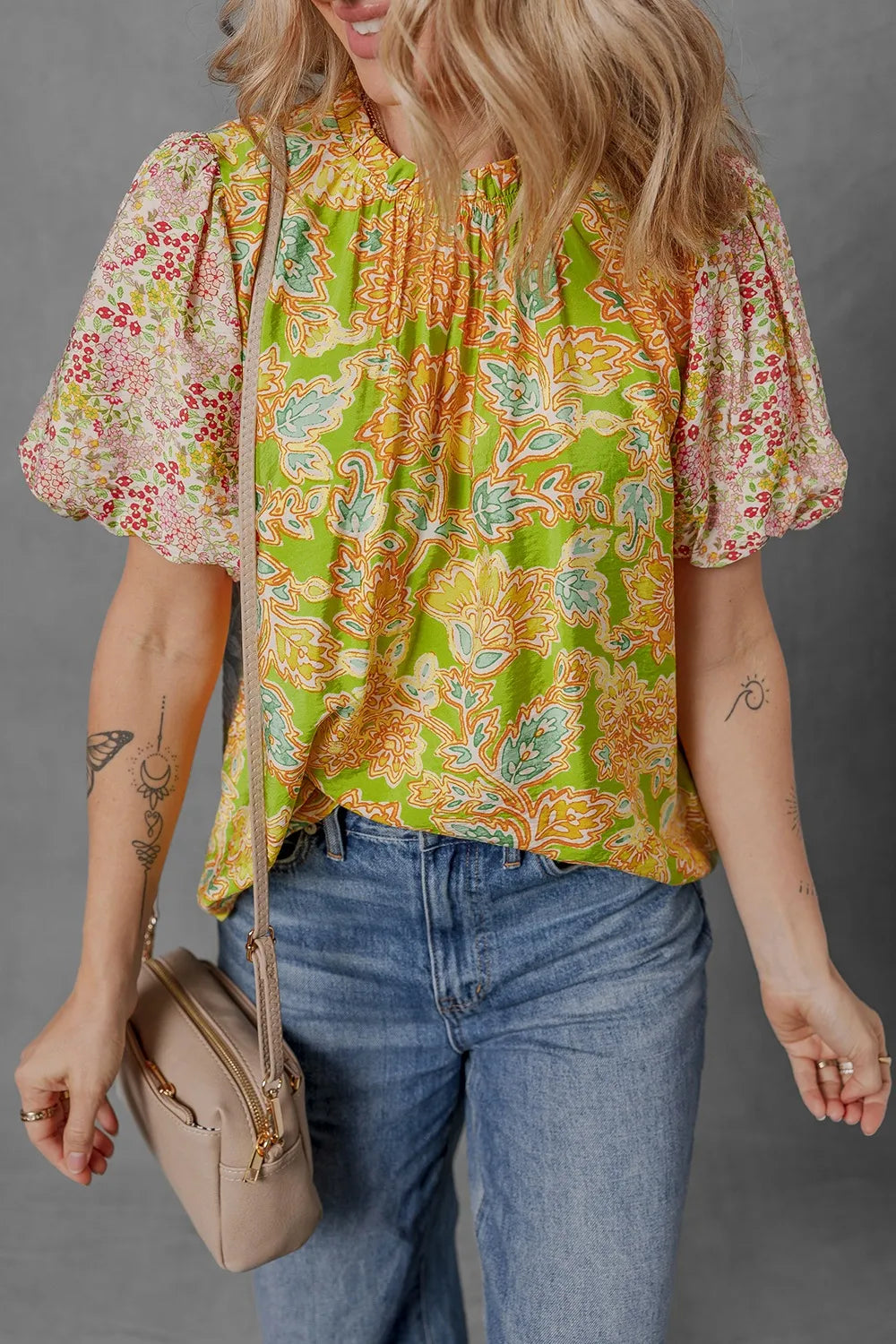 Patchwork blouse with bubble sleeves, vibrant print, and contrast details by Verve369.